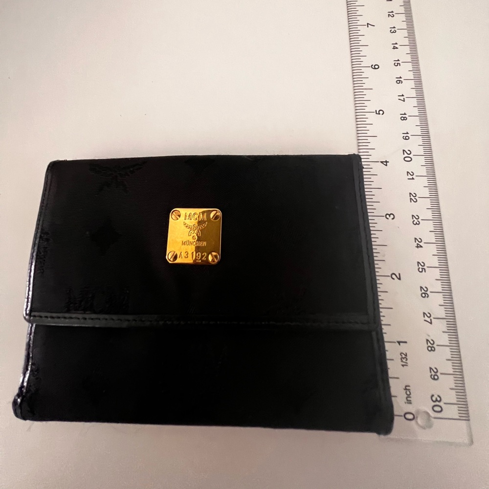 MCM Black Patent Accessory with Gold Logo Plate